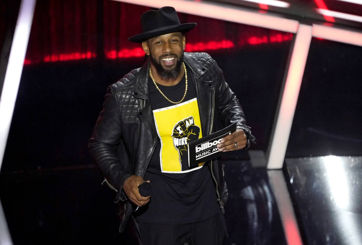 FILE - Stephen "tWitch" Boss presents the award for top Latin artist at the Billboard ...