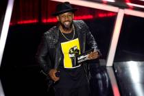 FILE - Stephen "tWitch" Boss presents the award for top Latin artist at the Billboard ...