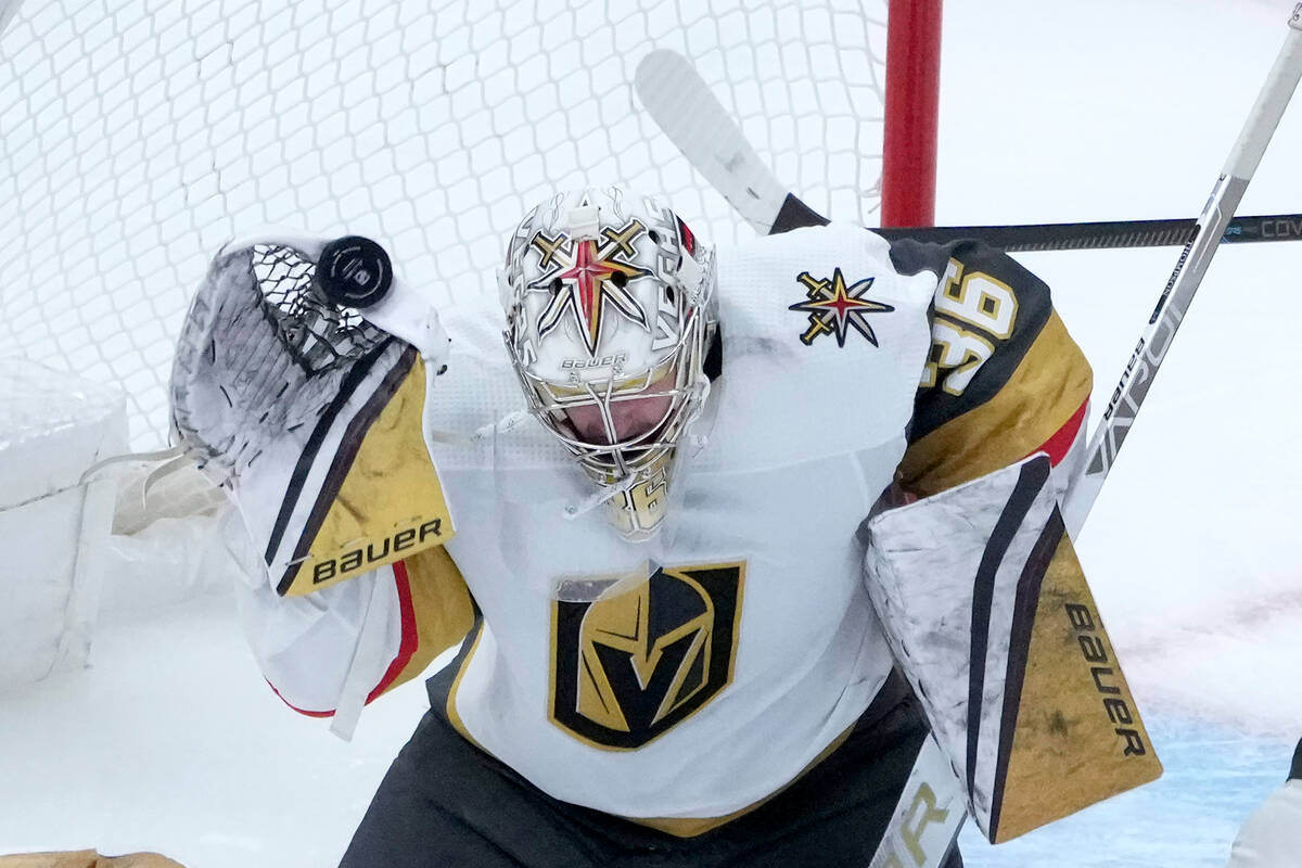 Vegas Golden Knights goaltender Logan Thompson deflects a shot above the net with his glove dur ...