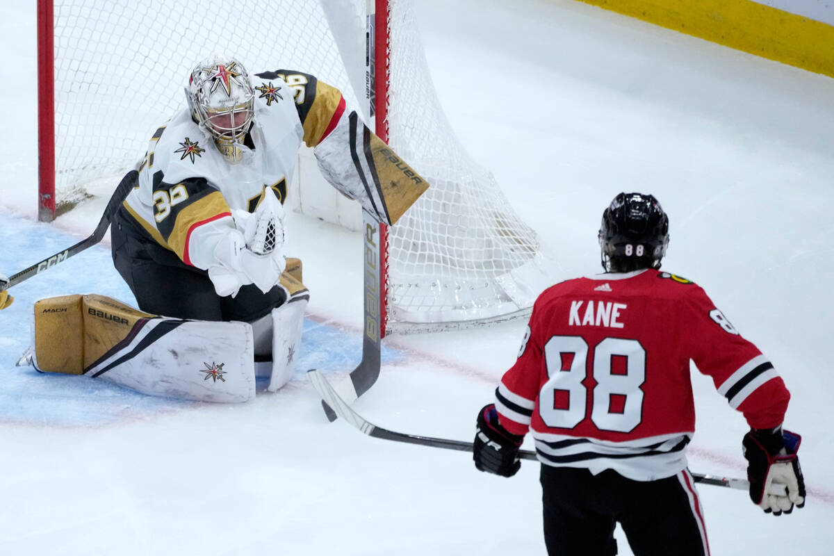 Vegas Golden Knights goaltender Logan Thompson makes a glove save on a shot by Chicago Blackhaw ...