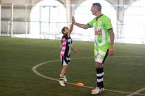 Italy World Cup soccer star Marco Materazzi, right, works with 9-year-old Bella Antonopoulos du ...
