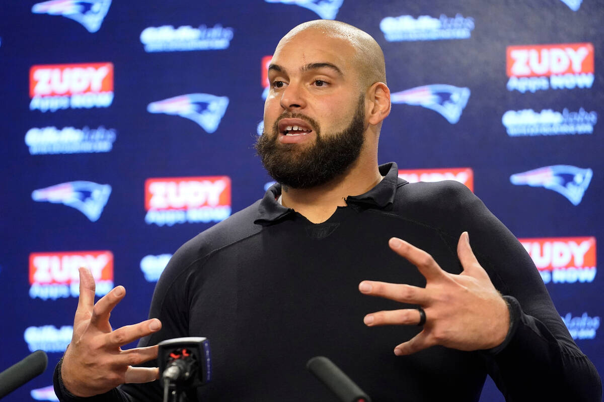 New England Patriots defensive end Lawrence Guy speaks with reporters following NFL football pr ...