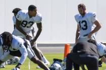 Raiders tight end Darren Waller (83) and Raiders wide receiver Hunter Renfrow (13) stretch duri ...