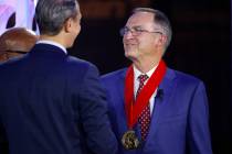 FILE - Former Kansas State, Florida, Illinois, UNLV and Oklahoma head coach Lon Kruger, right, ...