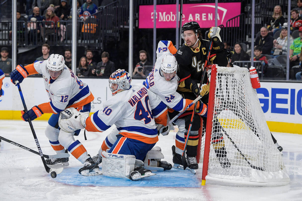 New York Islanders right wing Josh Bailey (12) helps clear the puck out of the crease during th ...