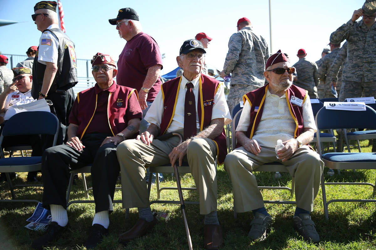 Former prisoners of war, from left, Gene Ramos, Dean Whitaker and Vincent Shank attend a POW/MI ...
