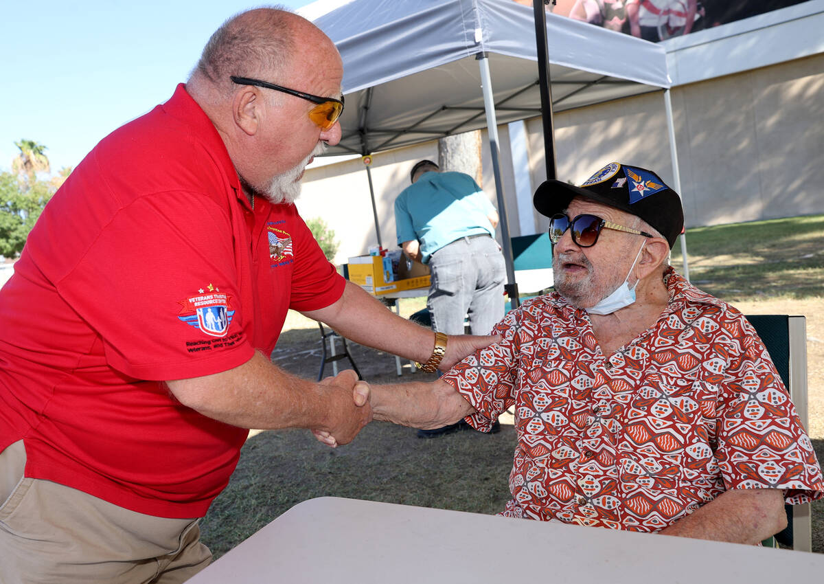 World War II veteran Vincent Shank, right, is honored by J.B. Brown on his 105th birthday at Ch ...