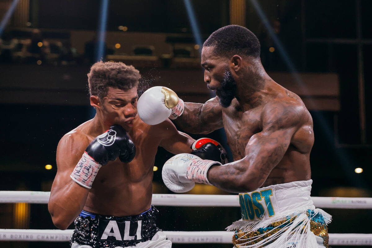 Frank Martin, right, punches Michel Rivera during their fight Saturday, Dec. 17, 2022, at the C ...