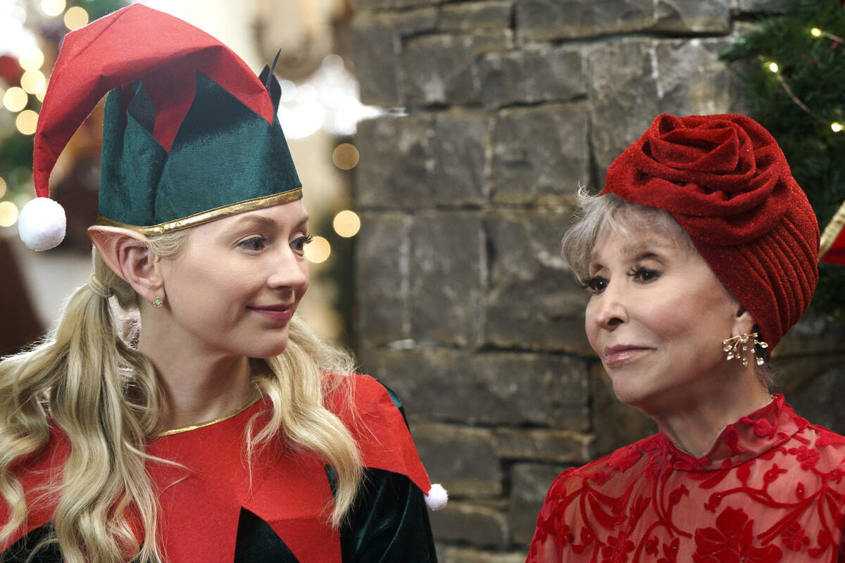 Emily Kinney, left, and Rita Moreno in a scene from "Santa Bootcamp." (Lifetime)