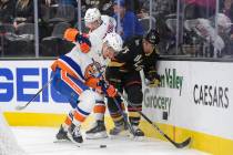 New York Islanders left wing Anders Lee (27) and Vegas Golden Knights defenseman Alec Martinez ...