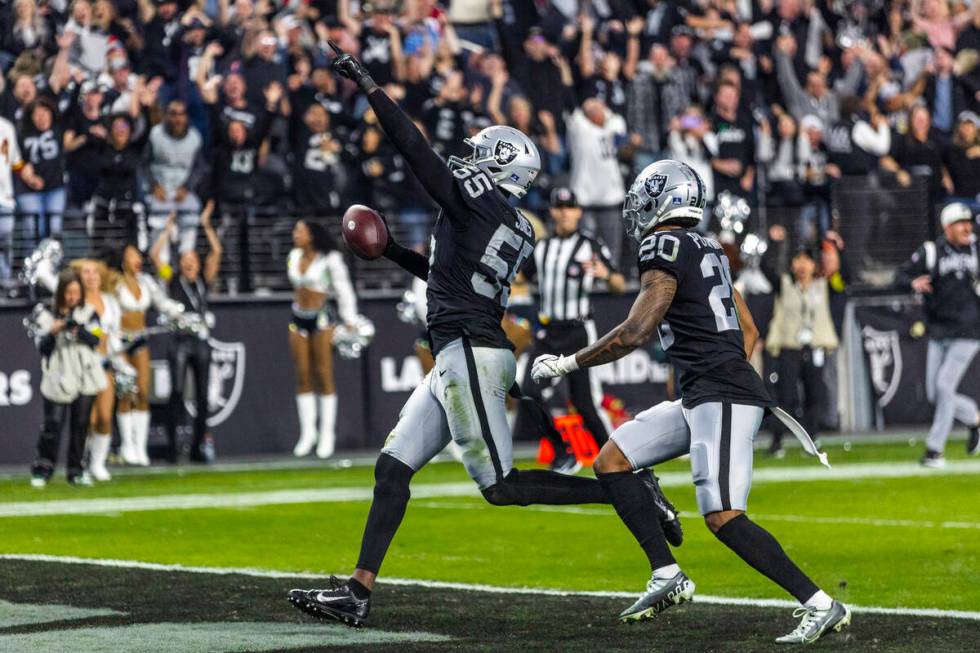 Raiders defensive end Chandler Jones (55) celebrates as he scores a game-winning touchdown over ...