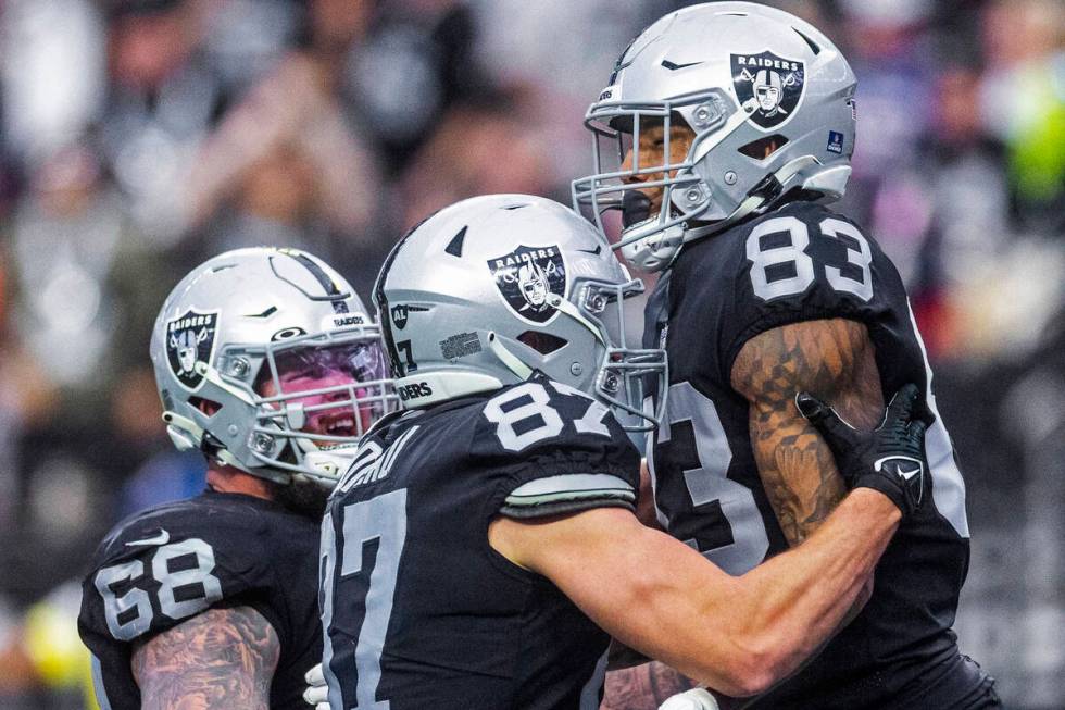 Raiders tight end Darren Waller (83) celebrates a touchdown catch with teammate tight end Foste ...