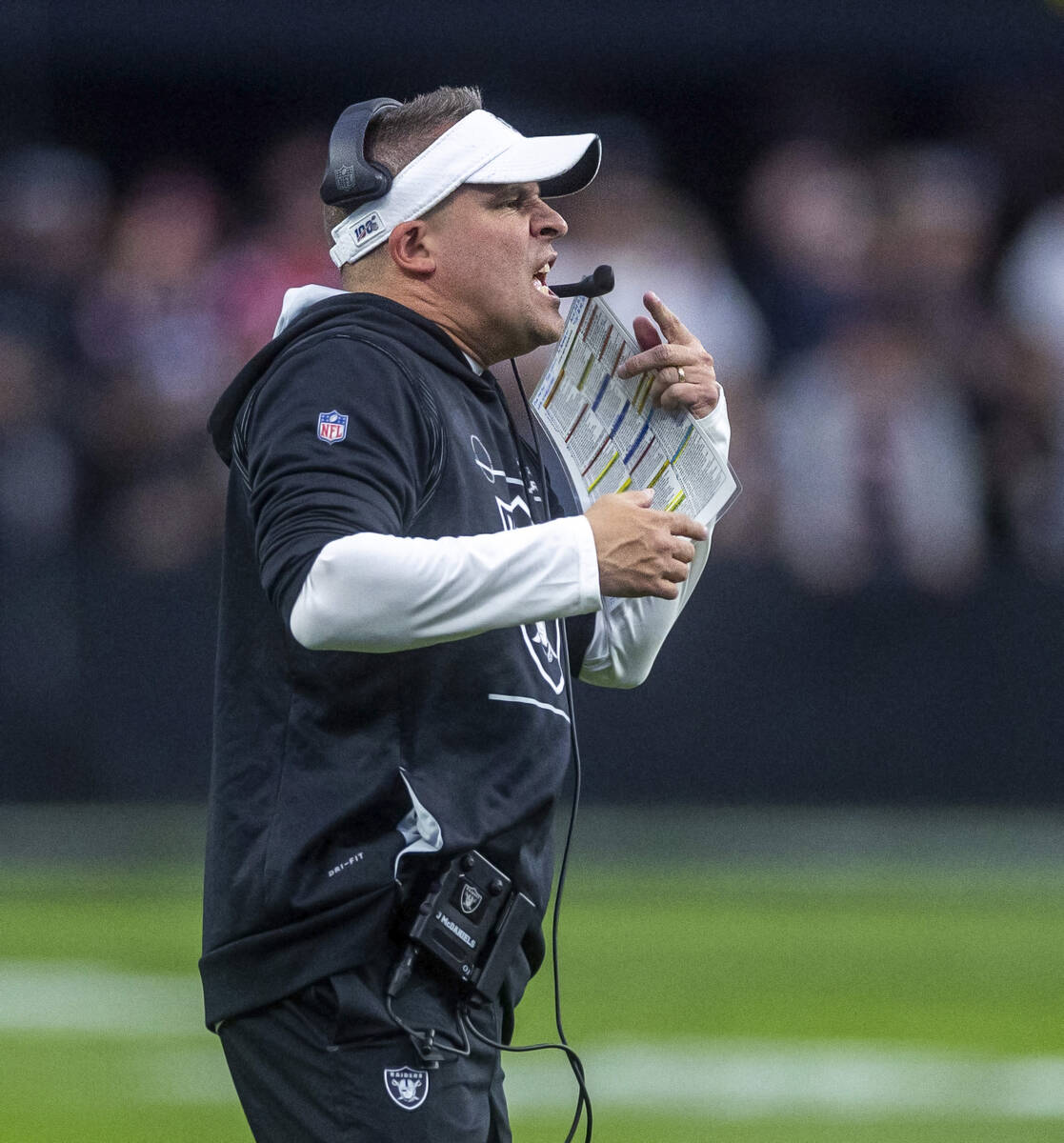 Raiders Head Coach Josh McDaniels yells to his players versus the New England Patriots during t ...