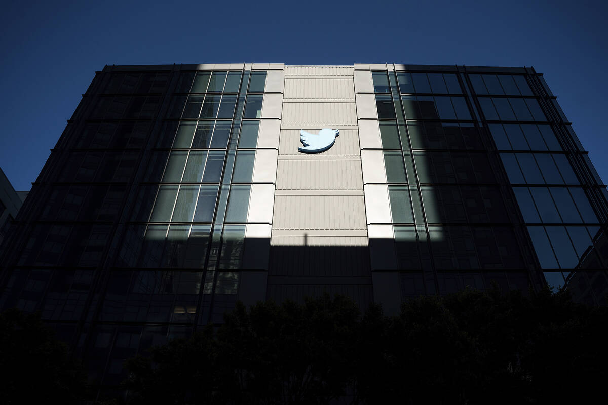 FILE - A Twitter logo hangs outside the company's San Francisco offices on Tuesday, Nov. 1, 202 ...