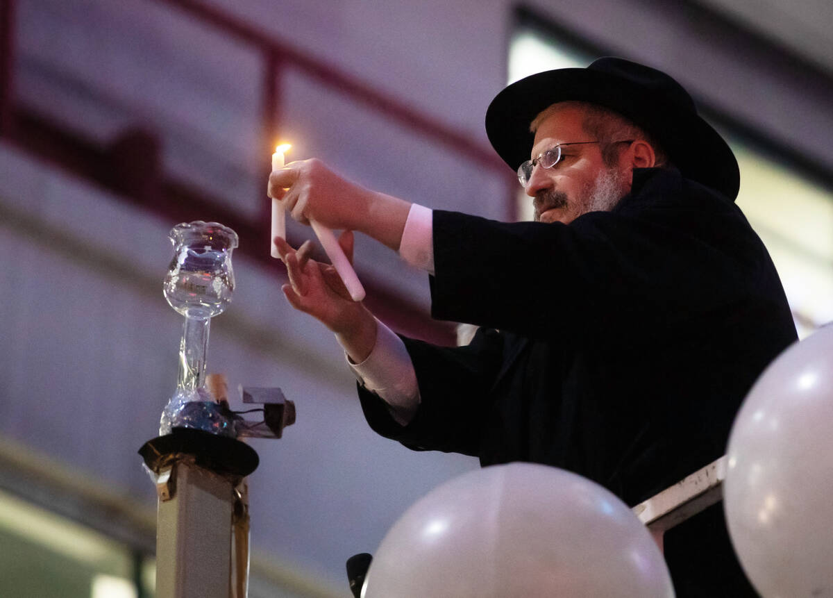 Rabbi Levi Harlig and Rabbi Shea Harlig from Chabad of Southern Nevada lead a ceremony to welco ...