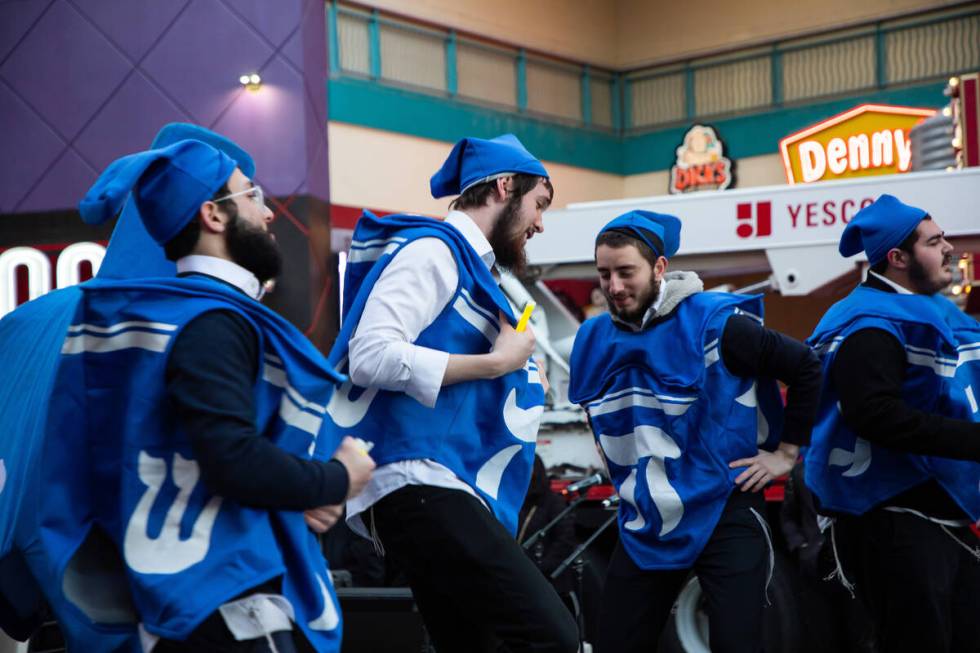 The Dancing Dreidels perform for the audience during a ceremony to celebrate the first night of ...