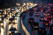FILE - In this Jan. 12, 2017, file photo, early morning rush hour traffic crawls along the Holl ...
