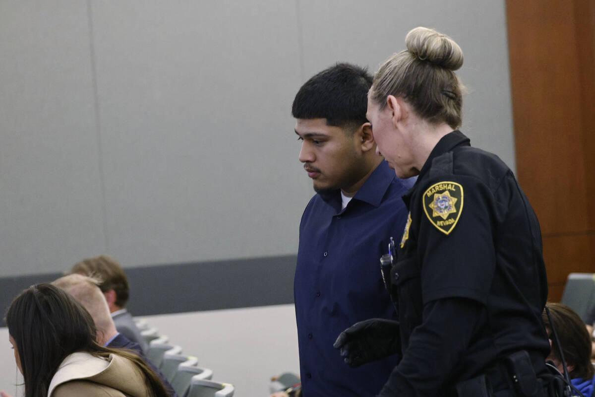 Joshua Estrada speaks to a court office before his sentencing hearing at the Regional Justice C ...