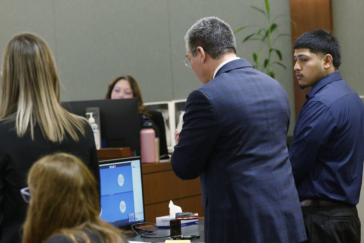 Joshua Estrada, right, stands next to his attorney John Turco while Turco speaks during Estrada ...