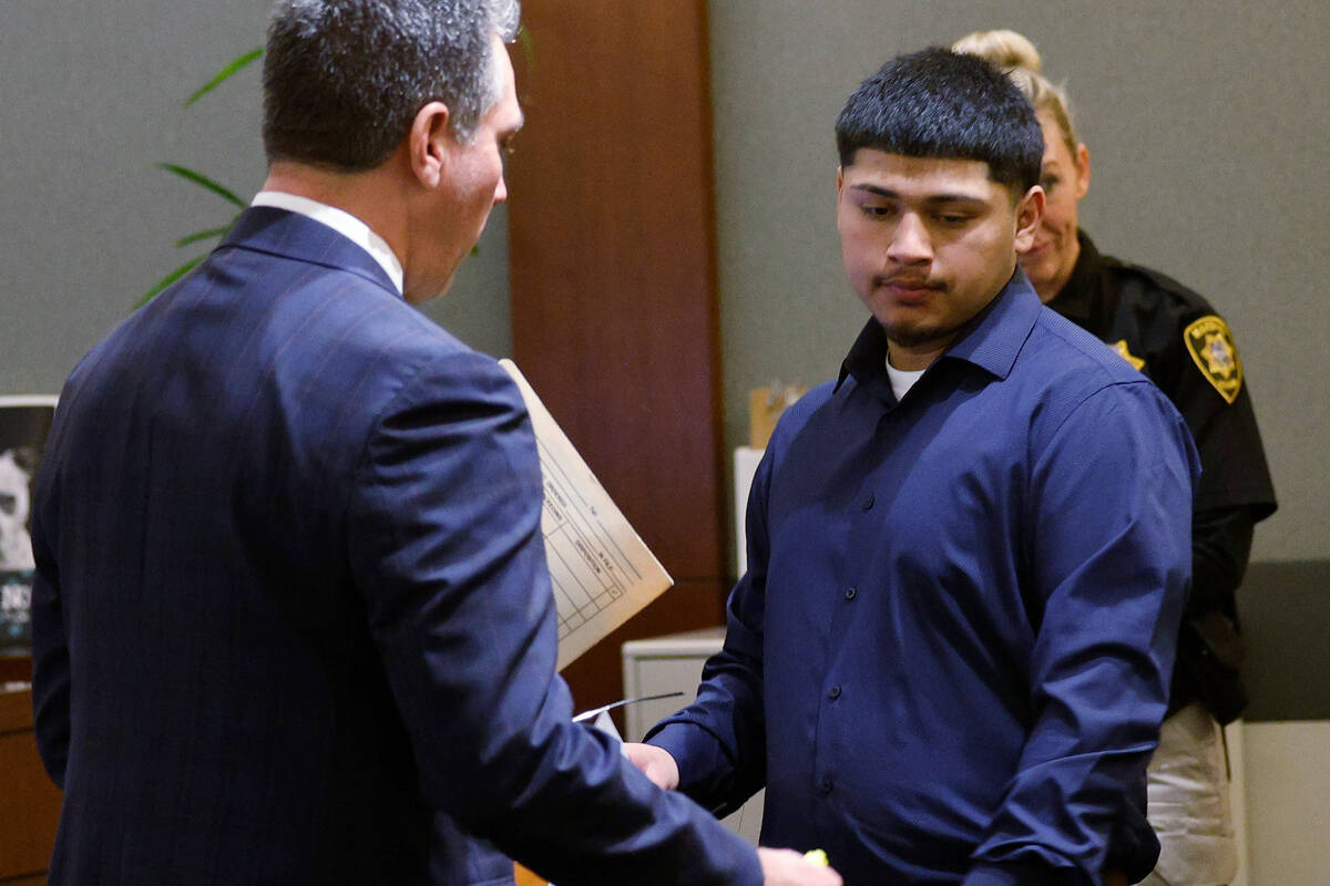 Joshua Estrada, right, leaves a courtroom after his sentence at the Regional Justice Center, Tu ...