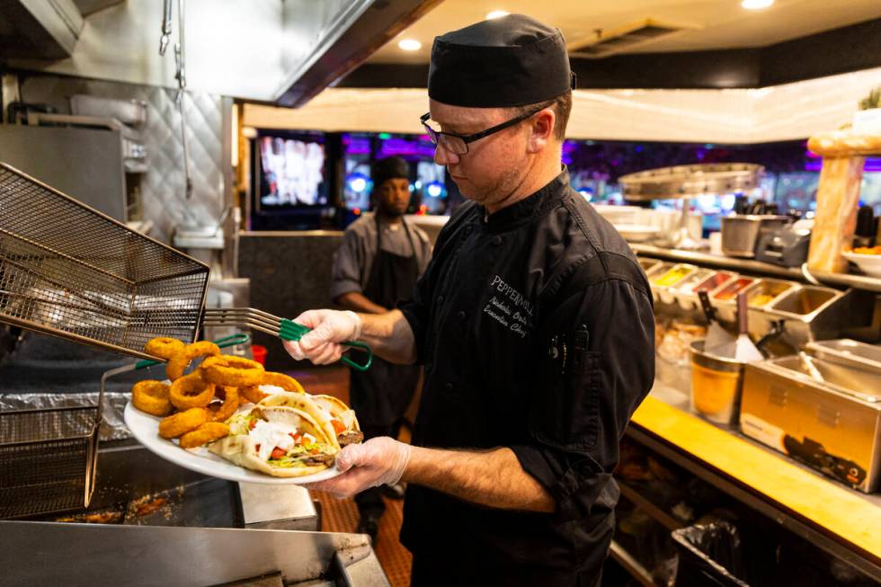 Executive Chef Nicholas Orth prepares gyros and onion rings at Peppermill on Wednesday, Dec. 14 ...