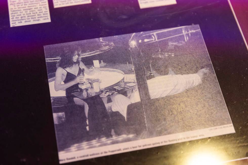 A cocktail waitress pours a beverage at the Fireside Lounge in the vintage photo at Peppermill ...