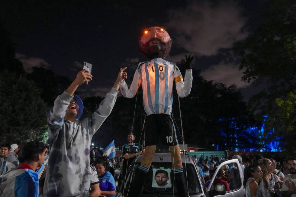 Fans waits for the arrival of the Argentine soccer team that won the World Cup outside the AFA ...