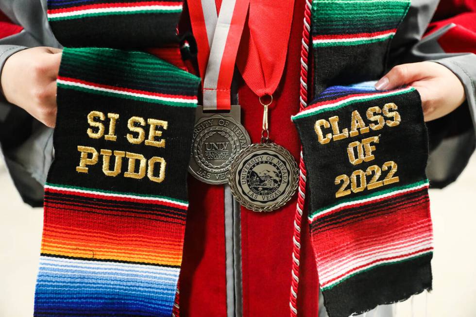 Maria Ramos Gonzalez holds her stole at the UNLV graduate degree graduation ceremony at the Tho ...