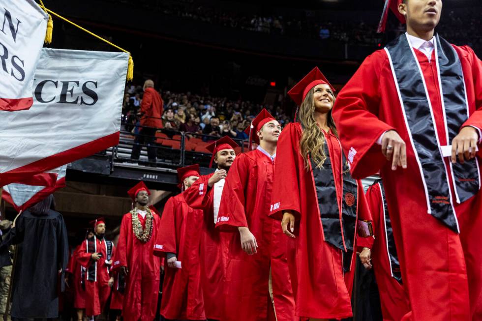 Students proceed to their seats during a UNLV commencement ceremony at the Thomas & Mack Ce ...