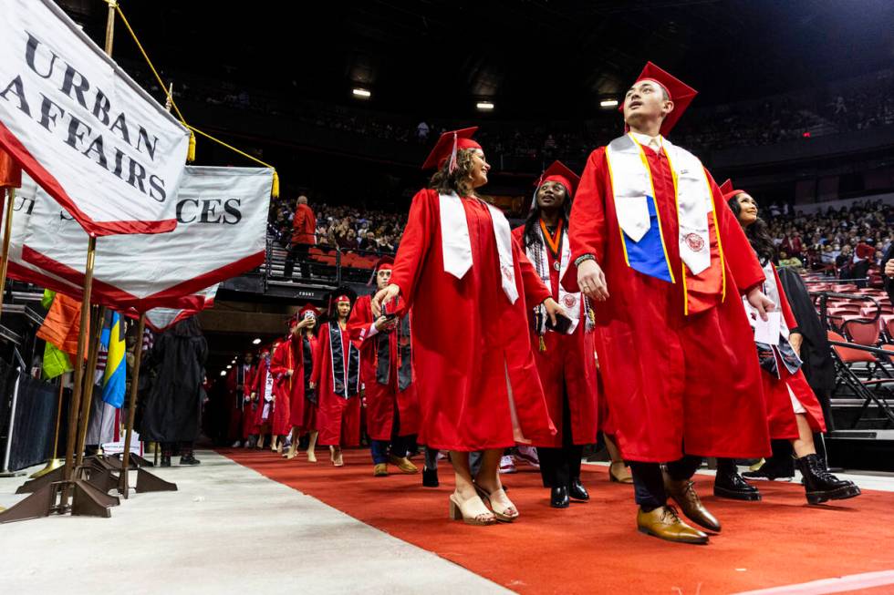 Students proceed to their seats during a UNLV commencement ceremony at the Thomas & Mack Ce ...