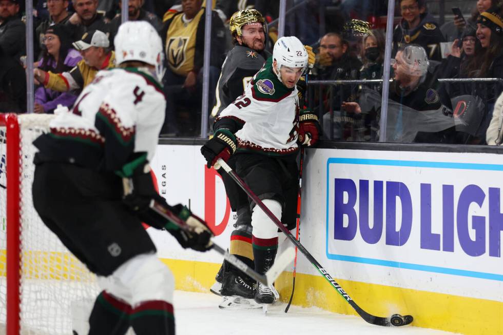 Vegas Golden Knights right wing Mark Stone (61) and Arizona Coyotes center Jack McBain (22) fig ...