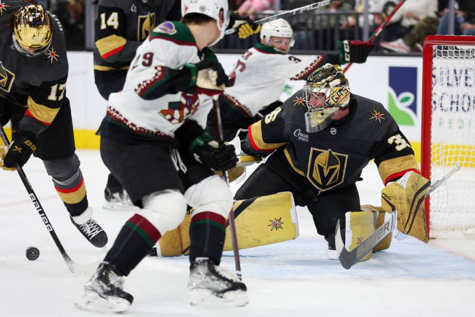 Vegas Golden Knights goaltender Logan Thompson (36) defends the goal against the Arizona Coyote ...