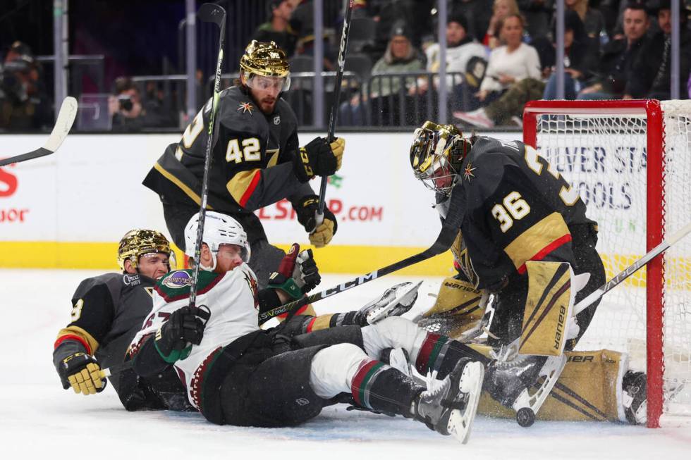 Vegas Golden Knights defenseman Brayden McNabb (3) and goaltender Logan Thompson (36) defend ag ...