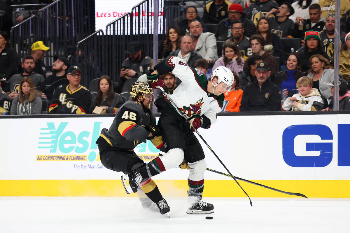 Vegas Golden Knights right wing Jonas Rondbjerg (46) pressures Arizona Coyotes defenseman Jakob ...