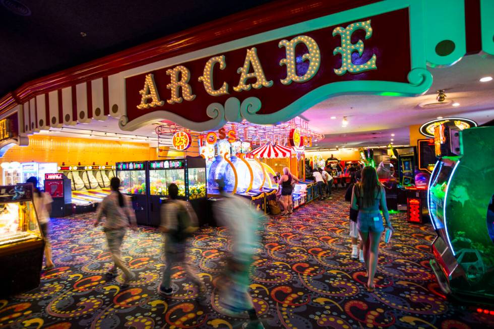 People pass by a variety of arcade games at the carnival midway at Circus Circus in Las Vegas o ...