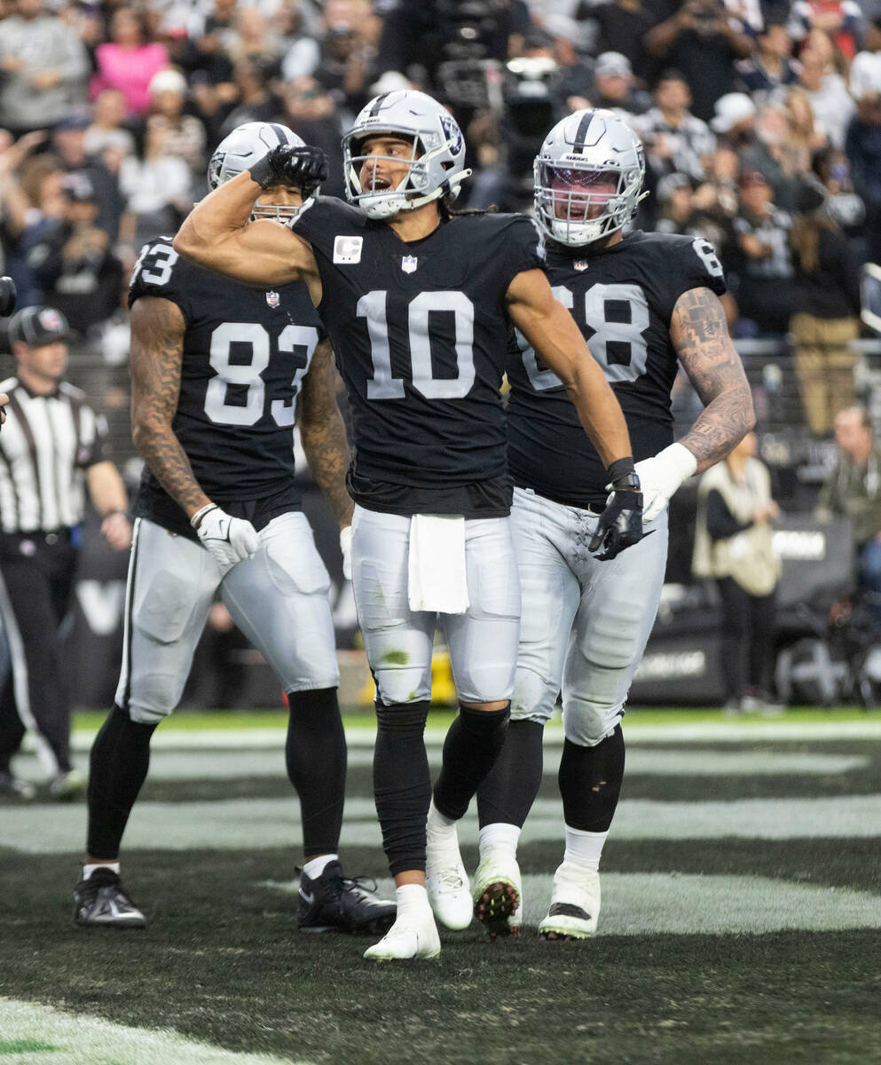 Raiders wide receiver Mack Hollins (10) flexes after scoring a touchdown during the first half ...