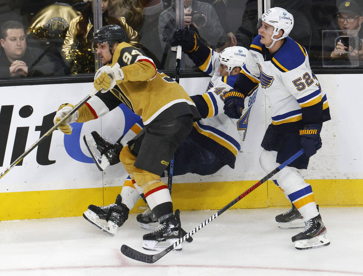 St. Louis Blues center Ivan Barbashev (49) loses his balance as he competes with Golden Knights ...