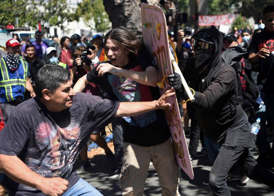 FILE- In this Aug. 27, 2017, file photo, demonstrators clash during a free speech rally in Berk ...