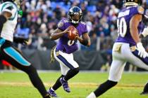 Baltimore Ravens quarterback Lamar Jackson (8) looks to pass the ball during the second half of ...
