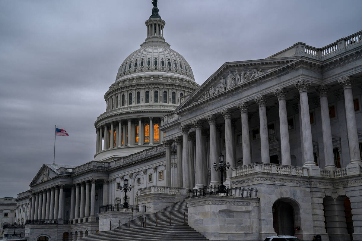 The Senate side of the Capitol is seen in Washington, early Thursday, Dec. 22, 2022, as lawmake ...