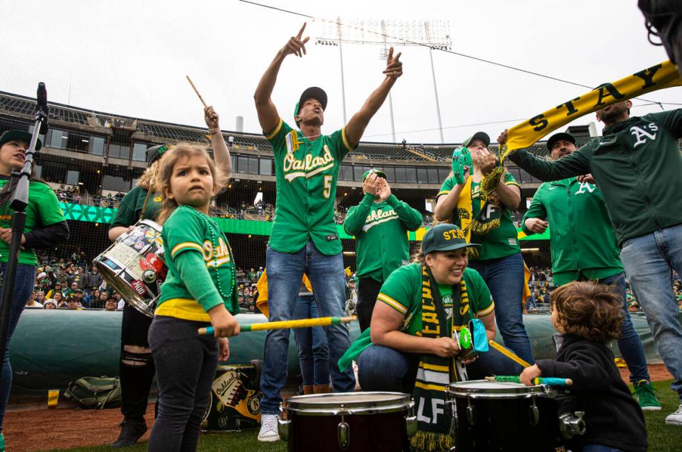 Oakland Athletics fans cheer before the opening night game against the Baltimore Orioles on Mon ...
