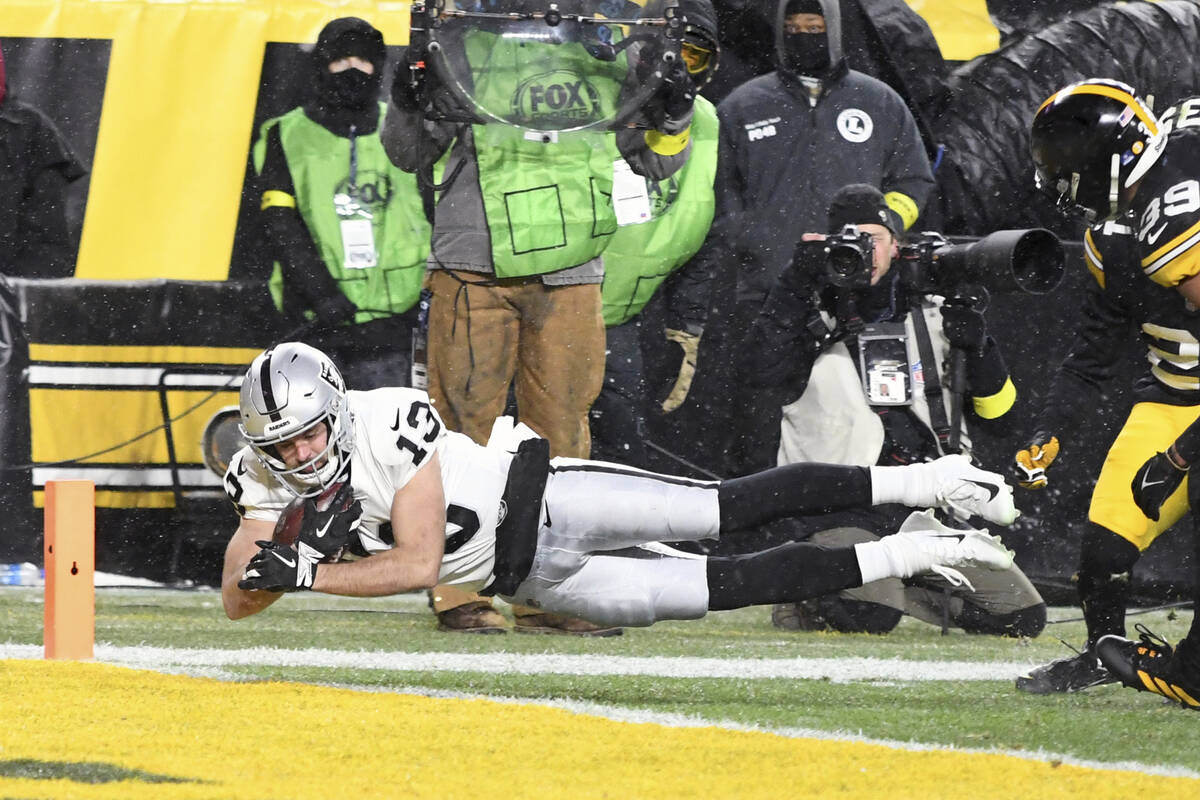 Las Vegas Raiders wide receiver Hunter Renfrow (13) dives for a touchdown during the first half ...
