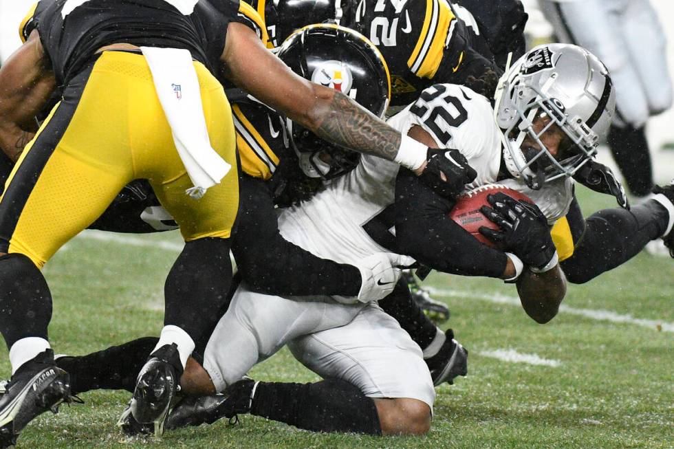 Las Vegas Raiders running back Ameer Abdullah (22) is tackled after a short gain during the fir ...