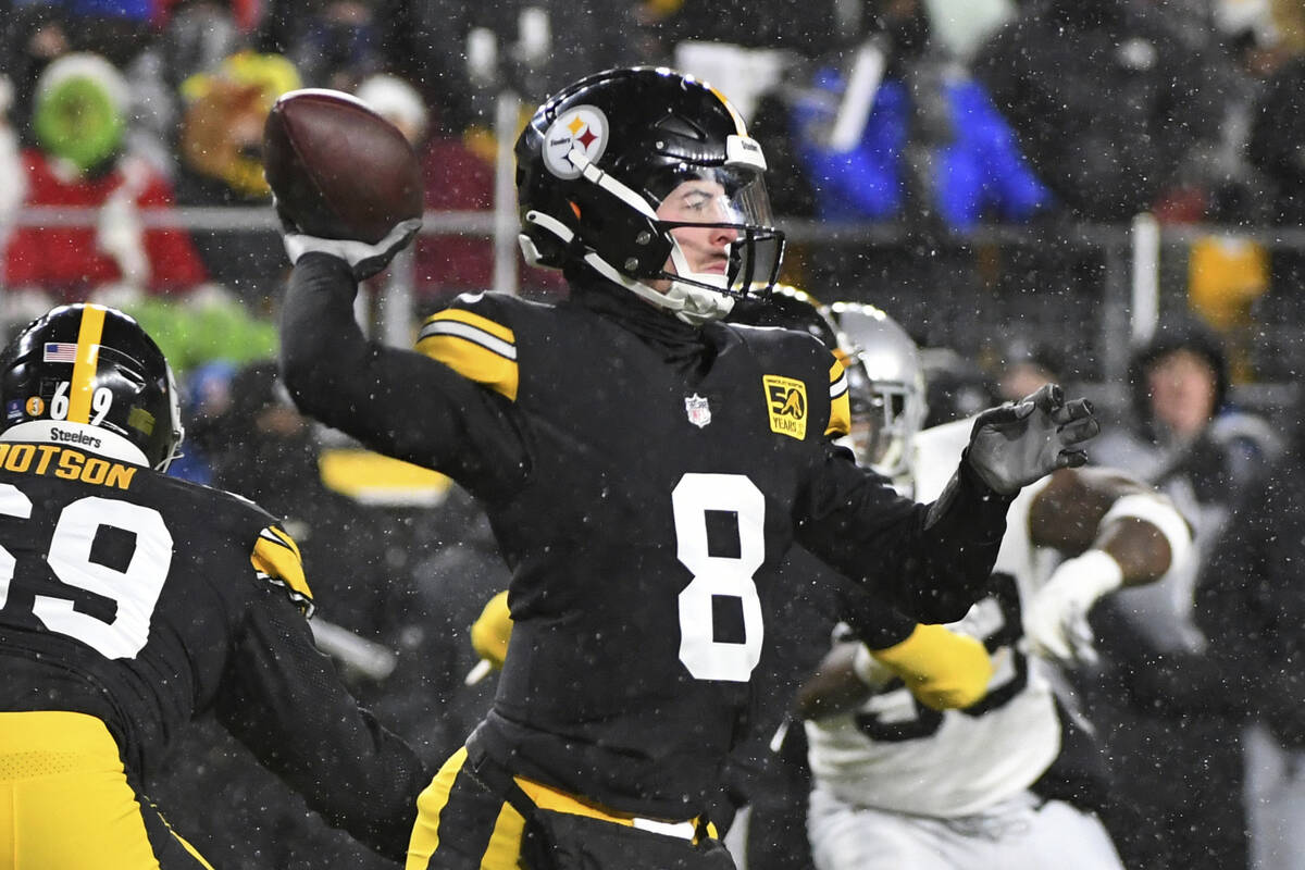 Pittsburgh Steelers quarterback Kenny Pickett (8) throws a pass during the first half of an NFL ...