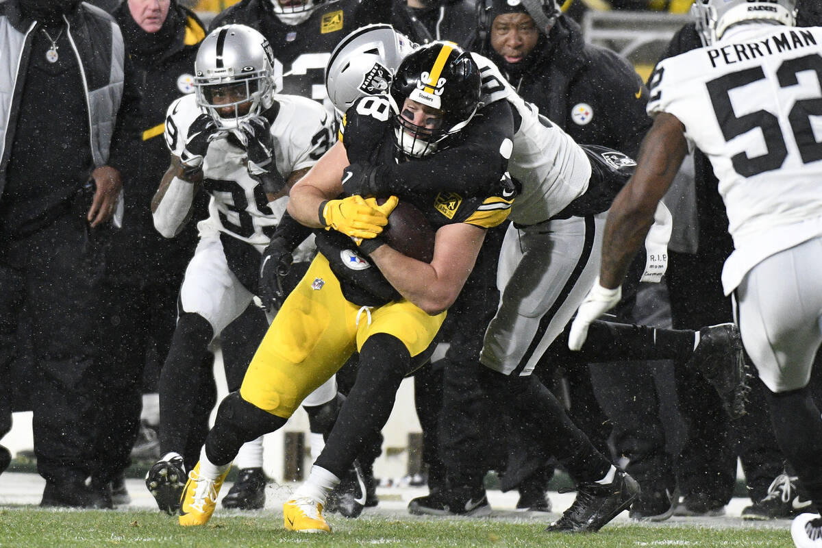 Pittsburgh Steelers tight end Pat Freiermuth (88) is tackled after a catch during the first hal ...