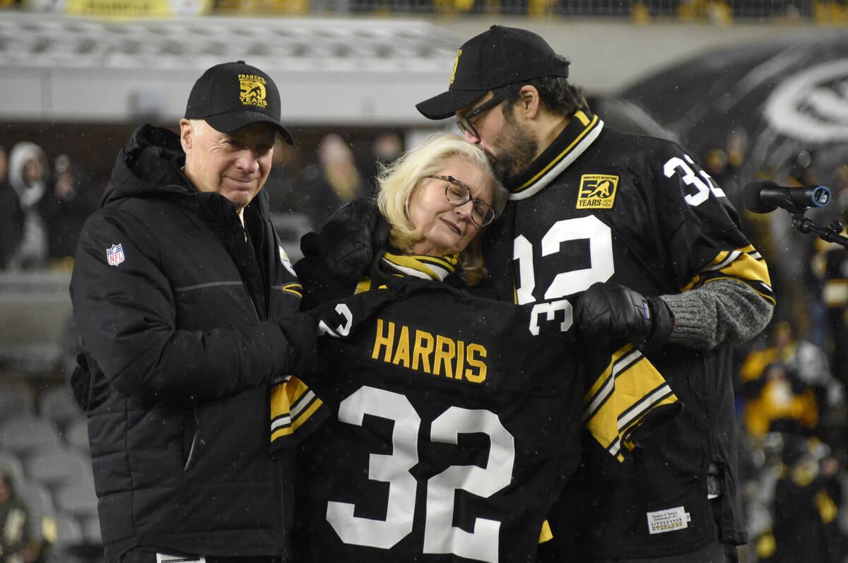 Pittsburgh Steelers owner Art Rooney II, left, and Franco Harris' wife Dana, center, and son Do ...