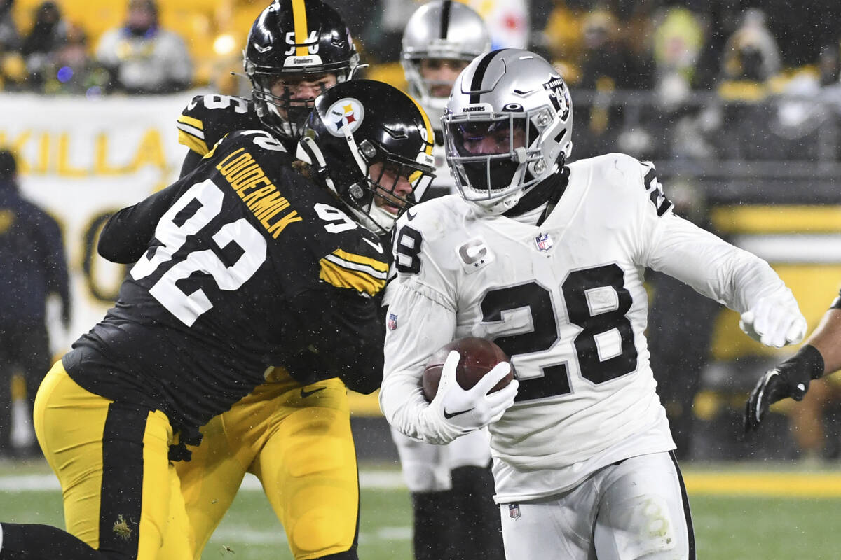 Las Vegas Raiders running back Josh Jacobs (28) carries the ball during the first half of an NF ...