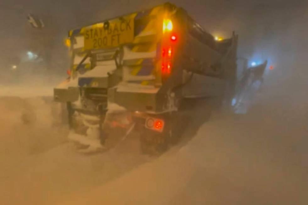 High winds and snow covers the streets and vehicles in Buffalo, N.Y. early Sunday, Dec. 25, 202 ...