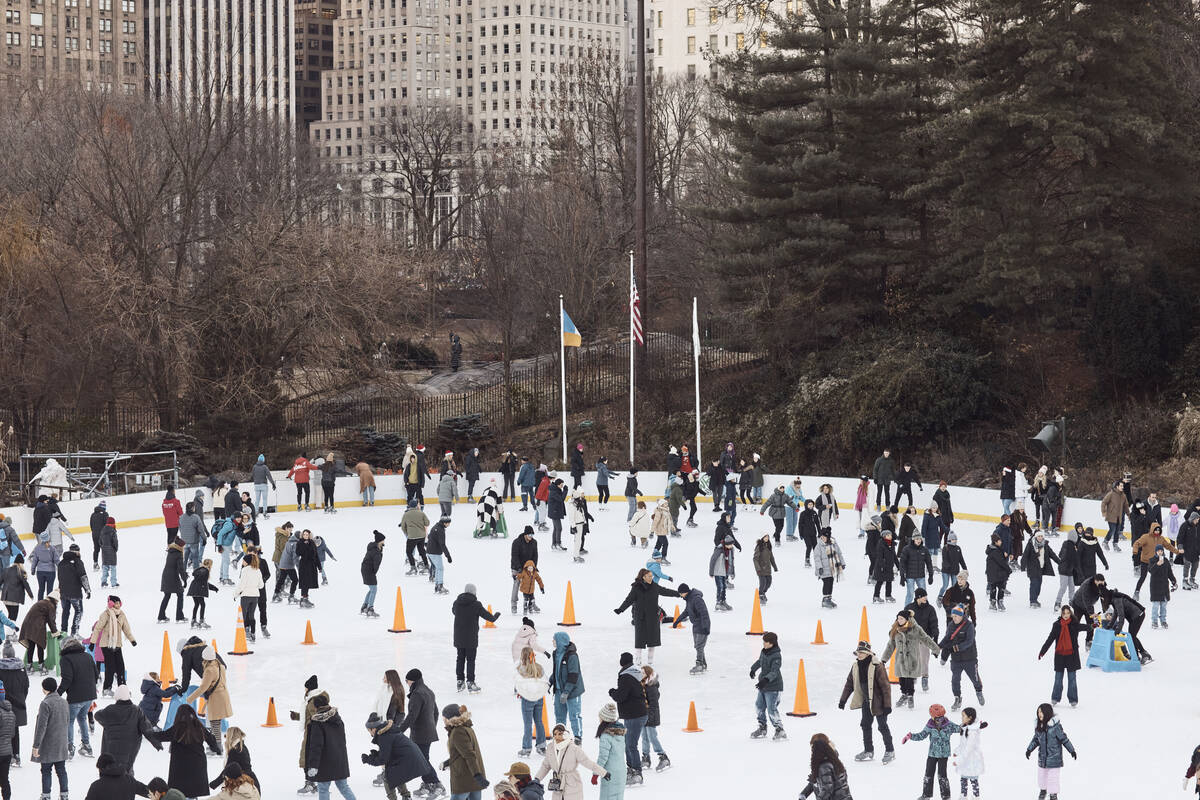 People ice skate on Christmas Day at Central Park on Sunday, Dec. 25, 2022, in New York. (AP Ph ...