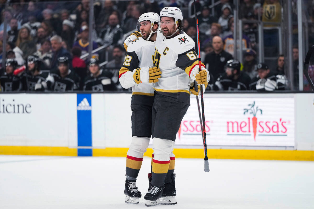 Vegas Golden Knights' Michael Amadio, left, celebrates his goal against the Los Angeles Kings w ...